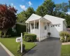 Welcoming ranch style exterior with an attached garage, private driveway, covered entry, and beautifully maintained landscaping. Welcoming ranch style exterior with an attached garage, private driveway, covered entry, and beautifully maintained landscaping.