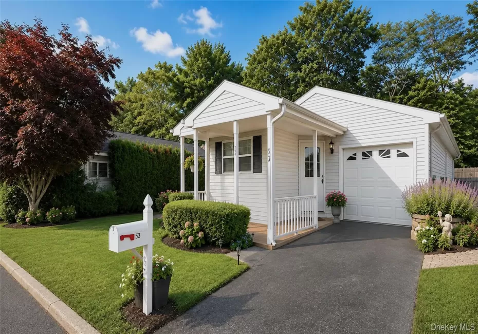 Welcoming ranch style exterior with an attached garage, private driveway, covered entry, and beautifully maintained landscaping. Welcoming ranch style exterior with an attached garage, private driveway, covered entry, and beautifully maintained landscaping.