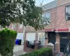 View of front of home featuring brick siding and roof with shingles View of front of home featuring brick siding and roof with shingles
