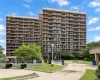 Multi-story building with a brick facade and numerous balconies Multi-story building with a brick facade and numerous balconies