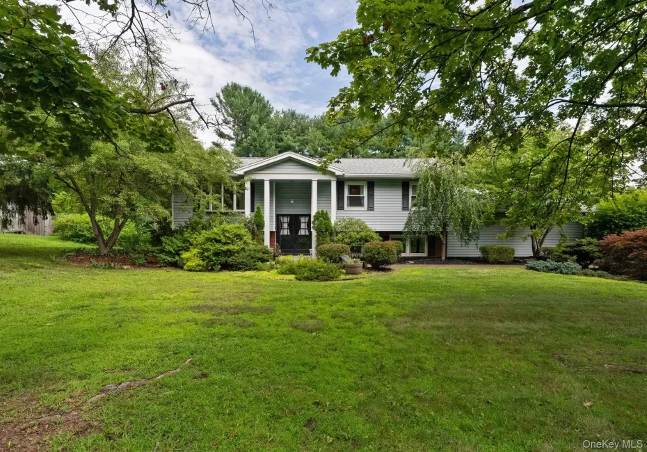 Expansive front lawn with mature trees and established landscaping Expansive front lawn with mature trees and established landscaping