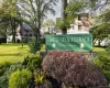 "Great Neck Terrace" community signage featuring a brick base and surrounding landscaping "Great Neck Terrace" community signage featuring a brick base and surrounding landscaping