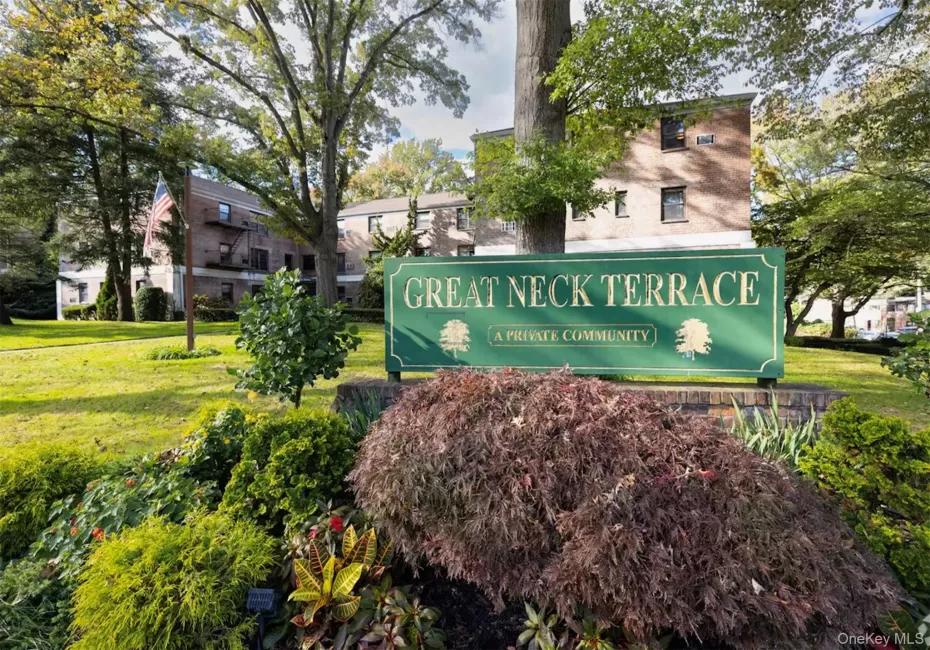 "Great Neck Terrace" community signage featuring a brick base and surrounding landscaping "Great Neck Terrace" community signage featuring a brick base and surrounding landscaping