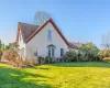 View of property exterior with a yard and a shingled roof View of property exterior with a yard and a shingled roof