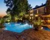 Twilight at 6 Canterbury Ct. in the resort-like property including pool with infinity edge, spa, patio, outdoor kitchen and firepit. Twilight at 6 Canterbury Ct. in the resort-like property including pool with infinity edge, spa, patio, outdoor kitchen and firepit.