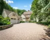 Large driveway, designed with pavers, Belgium block edging and stone wall. Large driveway, designed with pavers, Belgium block edging and stone wall.
