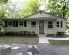 Behind this unassuming front entrance lie captivating architectural features and custom carpentry! Behind this unassuming front entrance lie captivating architectural features and custom carpentry!