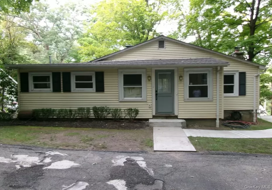 Behind this unassuming front entrance lie captivating architectural features and custom carpentry! Behind this unassuming front entrance lie captivating architectural features and custom carpentry!