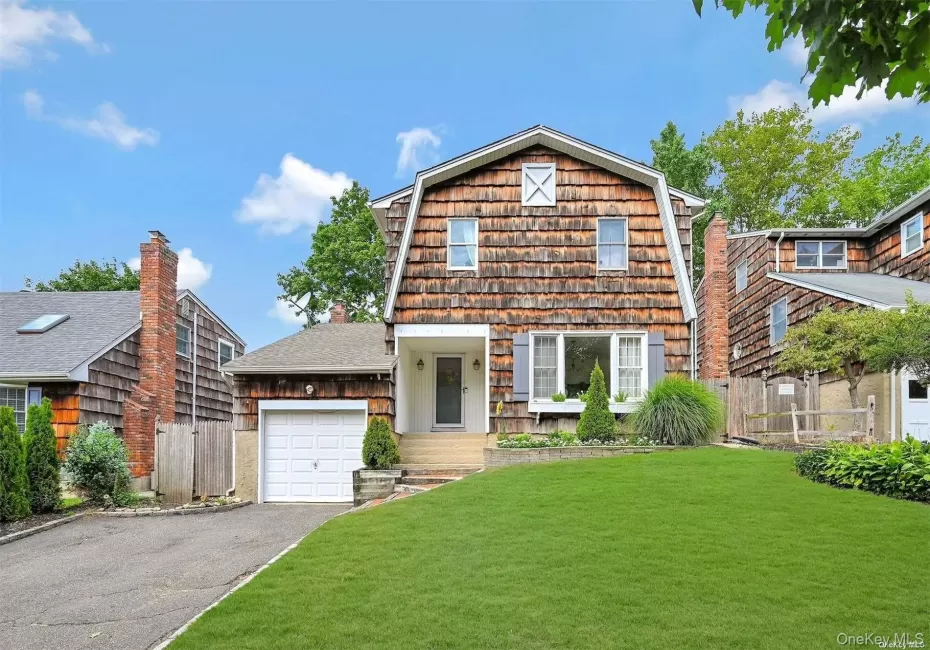 Gambrel-style exterior with wood shake siding Gambrel-style exterior with wood shake siding