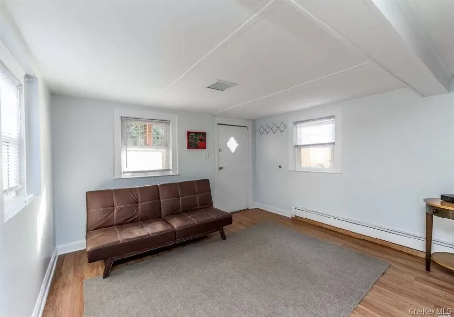 Living room with entrance door to apartment Living room with entrance door to apartment
