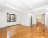Recessed ceiling beams, large multi-pane window, wood-finish parquet flooring Recessed ceiling beams, large multi-pane window, wood-finish parquet flooring