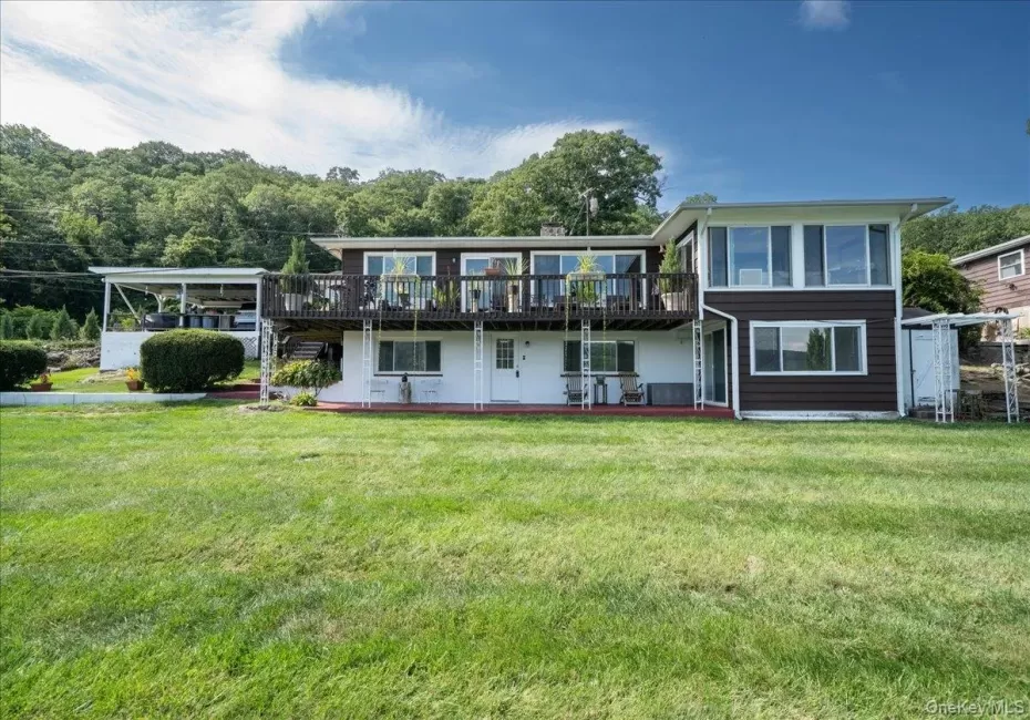 A large driveway leads to the ground level apartment overlooking Greenwood Lake & Sterling Forest. A large driveway leads to the ground level apartment overlooking Greenwood Lake & Sterling Forest.