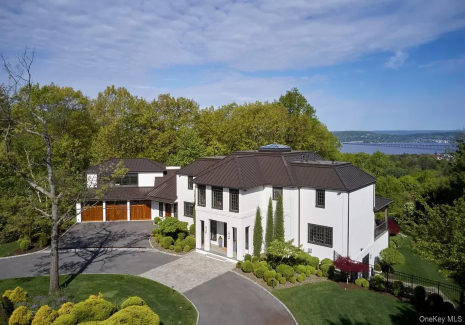 Magnificently set on 1.5 acres surrounded by lush lawns and beautiful perennial landscaping. Magnificently set on 1.5 acres surrounded by lush lawns and beautiful perennial landscaping.