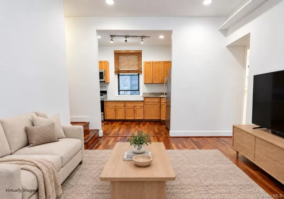 Hardwood flooring extends throughout the living area and into the kitchen Hardwood flooring extends throughout the living area and into the kitchen