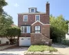 Brick exterior with decorative detailing, prominent chimney, and dormer window Brick exterior with decorative detailing, prominent chimney, and dormer window