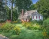 Front of home with beautiful front yard landscaping Front of home with beautiful front yard landscaping