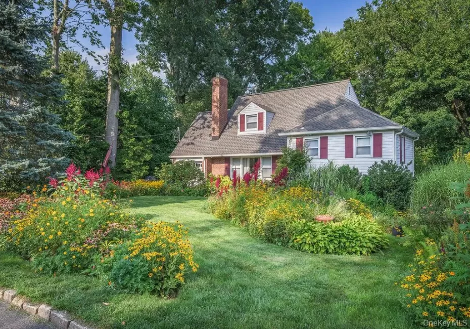 Front of home with beautiful front yard landscaping Front of home with beautiful front yard landscaping