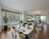 Dining room featuring a chandelier and baseboards Dining room featuring a chandelier and baseboards