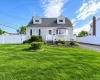 Siding exterior with dormer windows, bay window, and front porch Siding exterior with dormer windows, bay window, and front porch