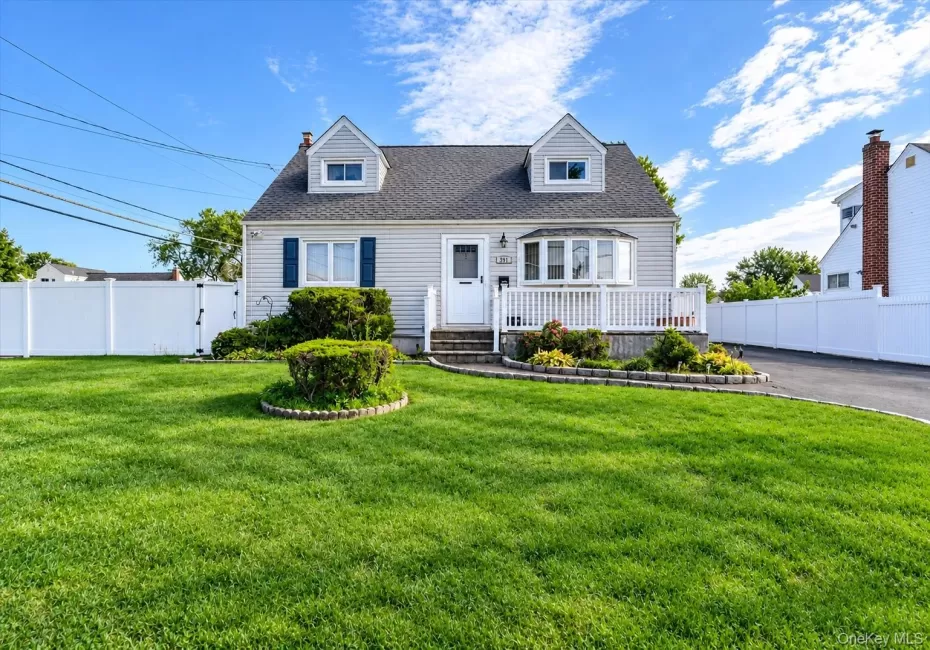 Siding exterior with dormer windows, bay window, and front porch Siding exterior with dormer windows, bay window, and front porch