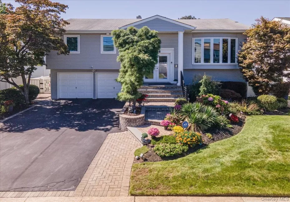 Professionally Landscaped, Paver Walkway to Staircase with Updated Railing Professionally Landscaped, Paver Walkway to Staircase with Updated Railing