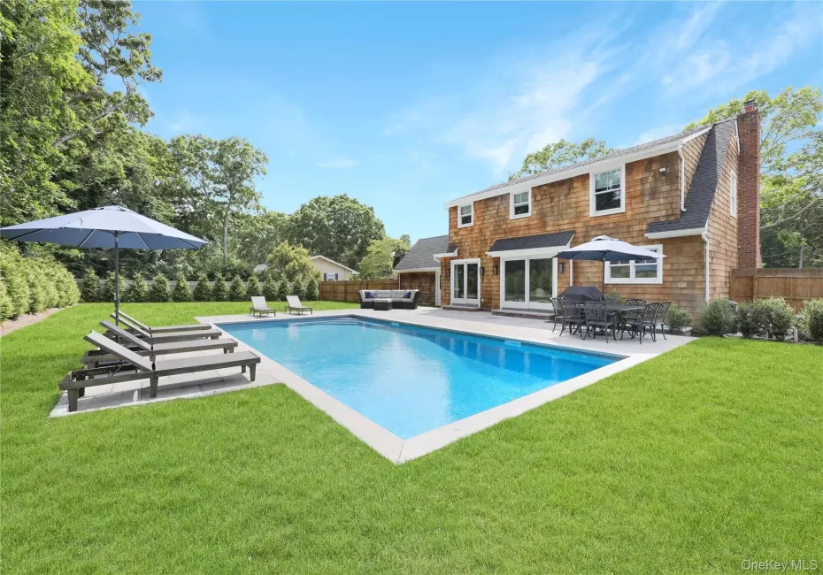 View of pool with a patio and a fenced backyard View of pool with a patio and a fenced backyard