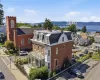 Aerial View — Historic Tarrytown ; the Hudson River. A spectacular aerial view showcasing the property in the heart of historic Tarrytown, surrounded by classic village architecture and overlooking the magnificent Hudson River. The iconic Governor Mario M. Cuomo Bridge creates a dramatic backdrop, highlighting the property’s exceptional setting between village charm and Hudson River beauty Aerial View — Historic Tarrytown ; the Hudson River. A spectacular aerial view showcasing the property in the heart of historic Tarrytown, surrounded by classic village architecture and overlooking the magnificent Hudson River. The iconic Governor Mario M. Cuomo Bridge creates a dramatic backdrop, highlighting the property’s exceptional setting between village charm and Hudson River beauty