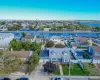 Aerial perspective of suburban area featuring a large body of water and a notable bridge Aerial perspective of suburban area featuring a large body of water and a notable bridge