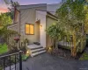 Welcoming end-unit entry surrounded by mature landscaping. Welcoming end-unit entry surrounded by mature landscaping.
