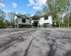 View of front of house featuring a garage and driveway View of front of house featuring a garage and driveway
