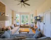 Hardwood flooring, exposed brick wall, bay window, ceiling fan, and recessed lighting Hardwood flooring, exposed brick wall, bay window, ceiling fan, and recessed lighting