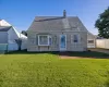 Front of home. Gabled roofline with shingle siding Front of home. Gabled roofline with shingle siding