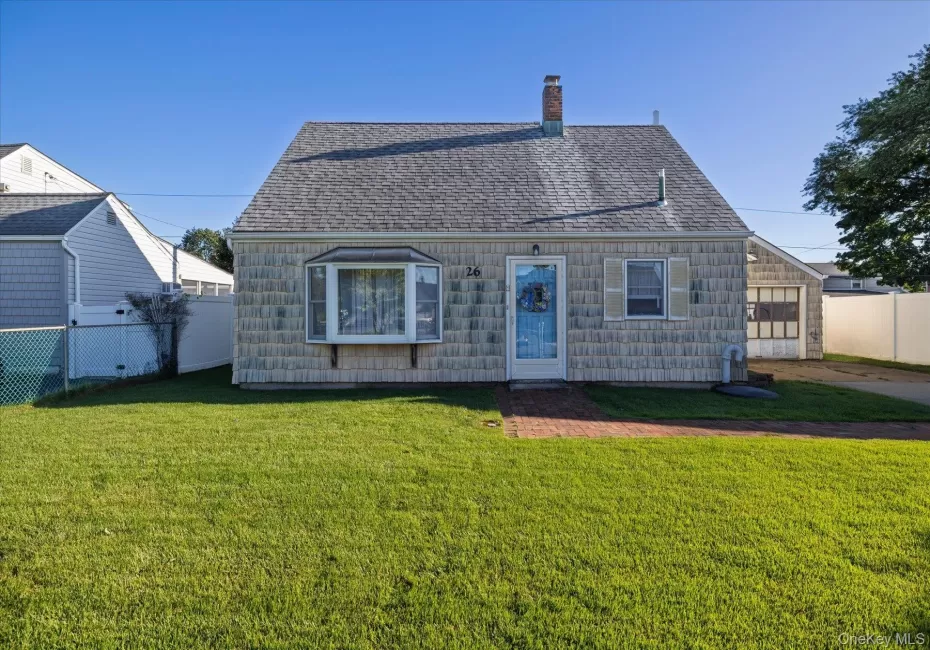 Front of home. Gabled roofline with shingle siding Front of home. Gabled roofline with shingle siding