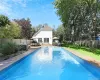 View of swimming pool with a fenced backyard, outdoor dining space, a patio, and an outdoor living space View of swimming pool with a fenced backyard, outdoor dining space, a patio, and an outdoor living space