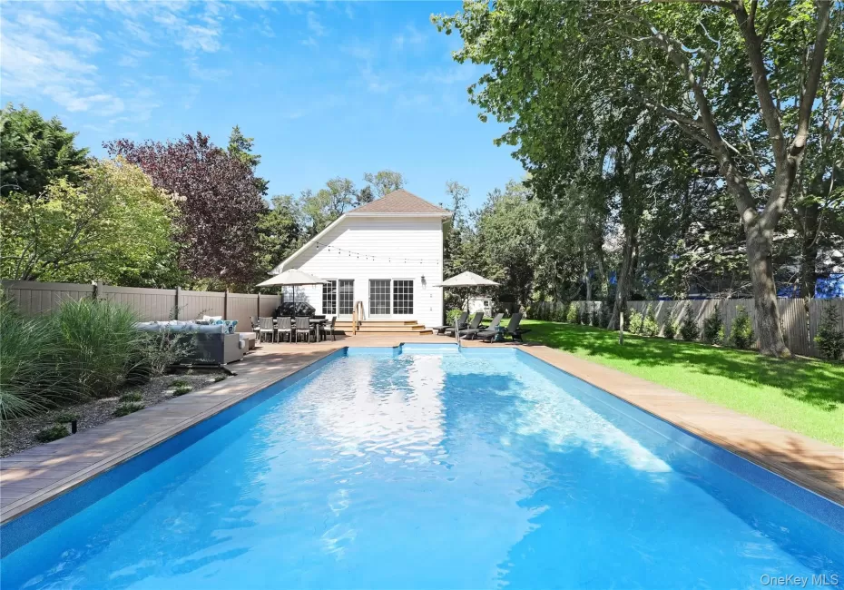 View of swimming pool with a fenced backyard, outdoor dining space, a patio, and an outdoor living space View of swimming pool with a fenced backyard, outdoor dining space, a patio, and an outdoor living space