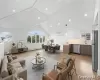 Vaulted ceiling with recessed lighting, Open floor Plan flooring, kitchen with stainless steel appliances, and Kitchen dining area Vaulted ceiling with recessed lighting, Open floor Plan flooring, kitchen with stainless steel appliances, and Kitchen dining area