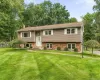 Split-level residence featuring a brick foundation and siding exterior Split-level residence featuring a brick foundation and siding exterior