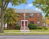 Welcome Home!Brick exterior, dual entryways, symmetrical front facade, concrete steps, and landscaped front yard Welcome Home!Brick exterior, dual entryways, symmetrical front facade, concrete steps, and landscaped front yard