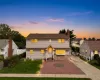 Two-story residence with siding and stone facade Two-story residence with siding and stone facade