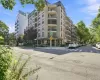 Multi-story residential building with private balconies and a ground-floor entrance Multi-story residential building with private balconies and a ground-floor entrance
