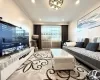 Recessed ceiling lighting, crown molding, and a built-in media console with storage Recessed ceiling lighting, crown molding, and a built-in media console with storage