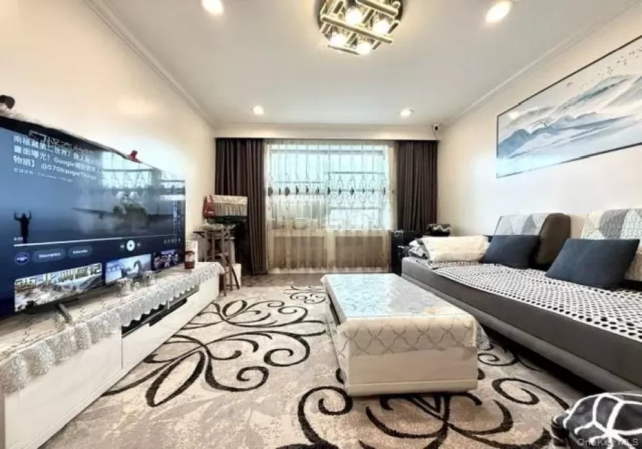 Recessed ceiling lighting, crown molding, and a built-in media console with storage Recessed ceiling lighting, crown molding, and a built-in media console with storage