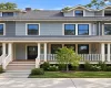 Light blue siding exterior with white trim and dark-framed windows Light blue siding exterior with white trim and dark-framed windows