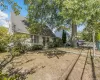 Rear view of property featuring roof with shingles Rear view of property featuring roof with shingles