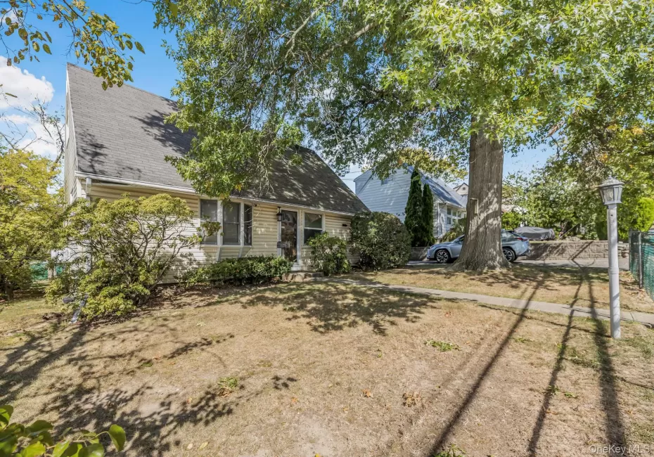 Rear view of property featuring roof with shingles Rear view of property featuring roof with shingles