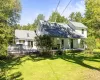 Exterior siding, covered front porch, skylights, pitched roof, and outdoor deck Exterior siding, covered front porch, skylights, pitched roof, and outdoor deck