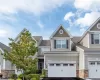 Front of townhome with 2 car garage Front of townhome with 2 car garage