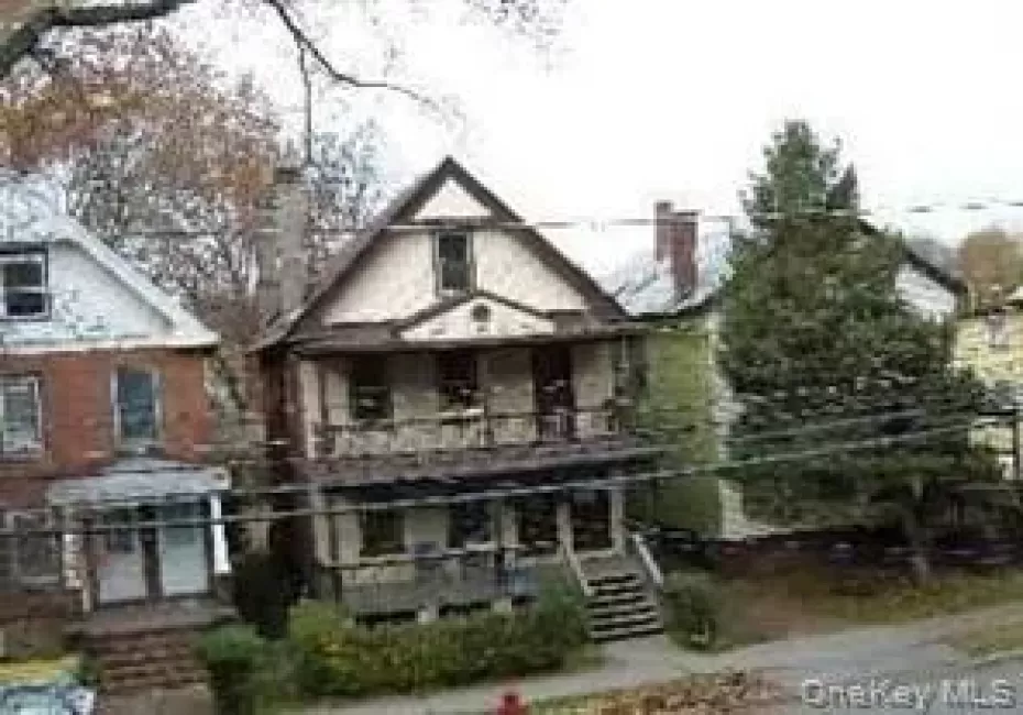 View of front of house featuring a balcony View of front of house featuring a balcony