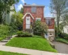 Brick colonial, perched on a hill with driveway. Brick colonial, perched on a hill with driveway.