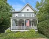 Front of home with beautiful porch with classic Sea Cliff charm Front of home with beautiful porch with classic Sea Cliff charm